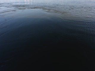 Abstract study of dark rippling water